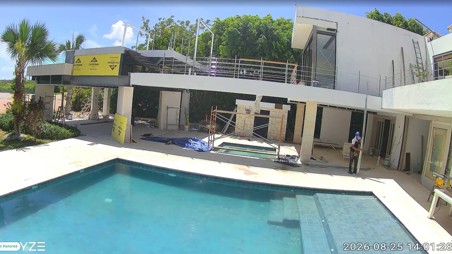 Existing ground-level pool at Villa Espada with the new upper terrace behind it, August 25 2026