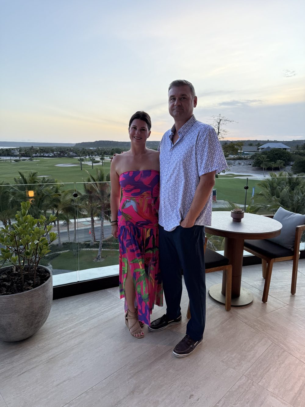 Robert and Kelly Bender on a Villa Espada terrace overlooking Punta Espada Golf Course at sunset, Cap Cana